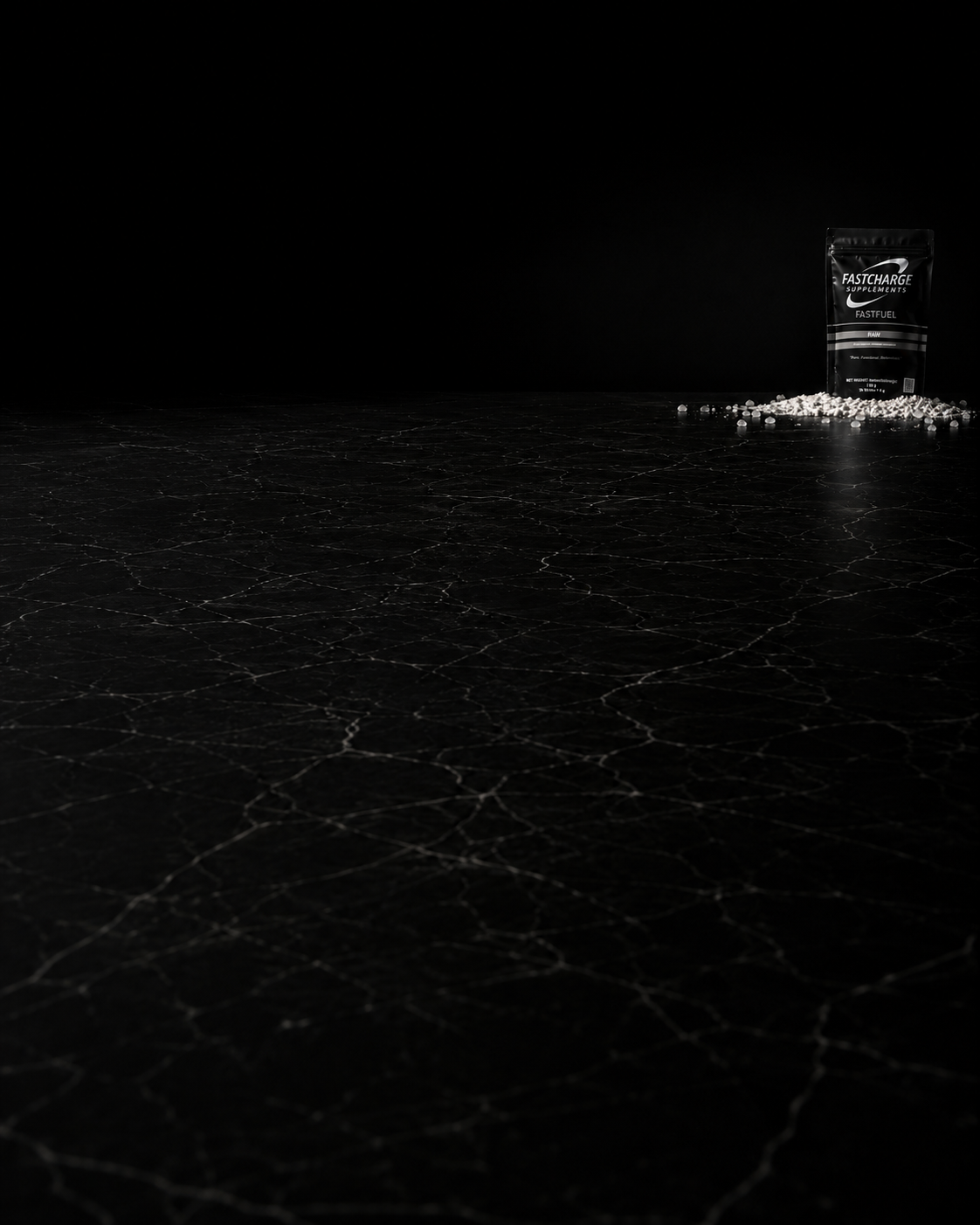 FastFuel pouch on a dark surface with scattered mineral salt